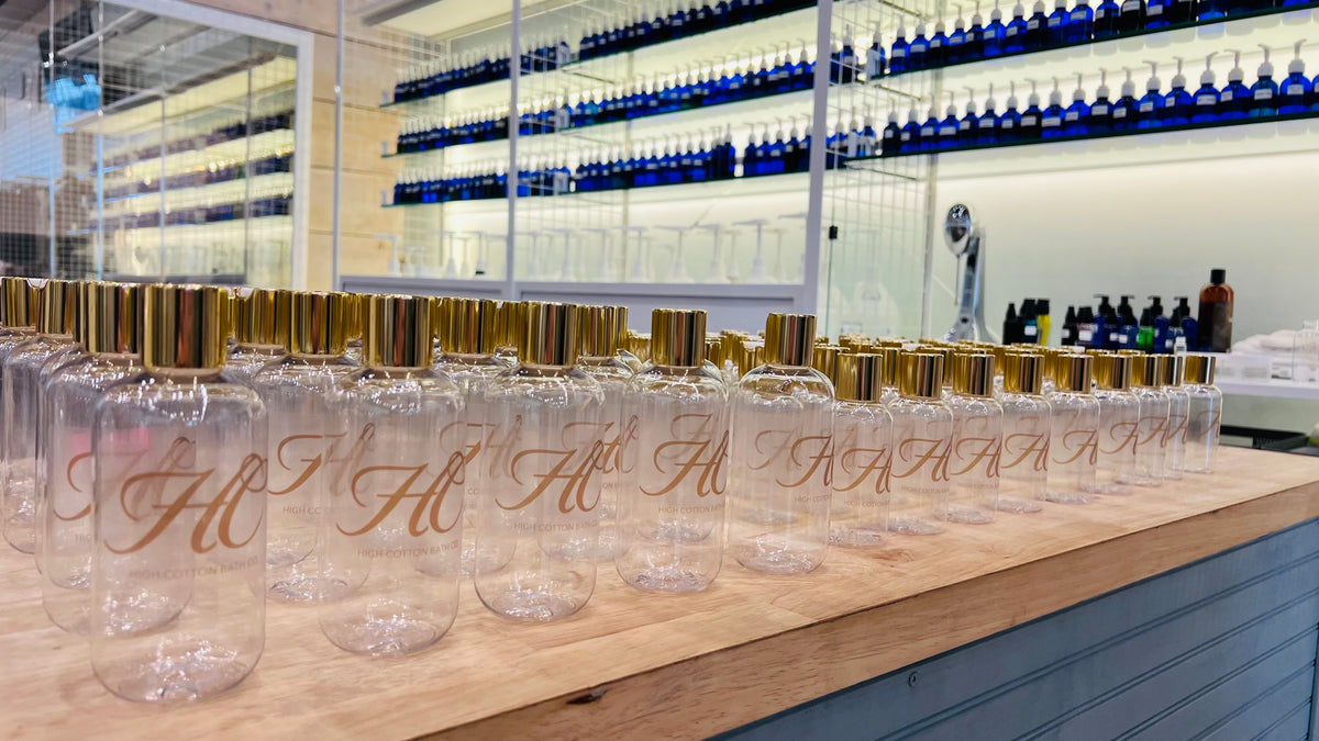 High Cotton Scent Lab fragrance bottles with gold-capped oils on display